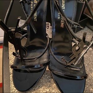 Black YSL open toe heels.